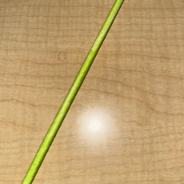 A green paper straw.