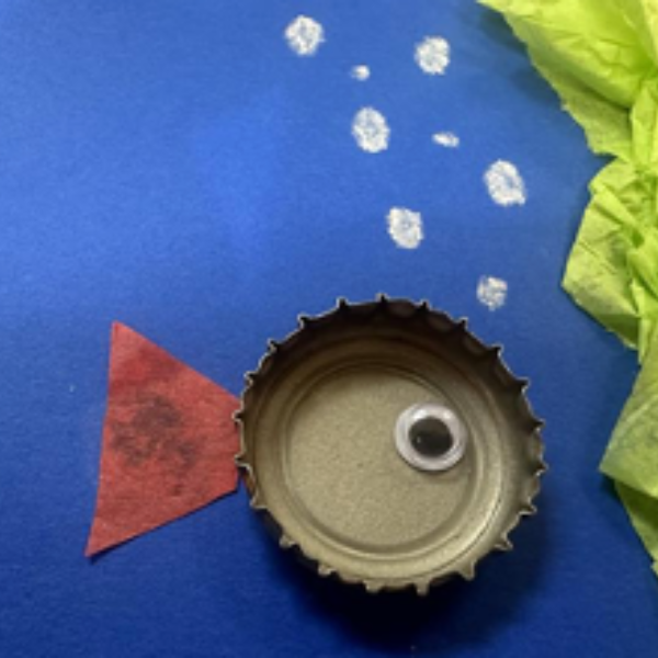 A fish made out of a bottle cap.