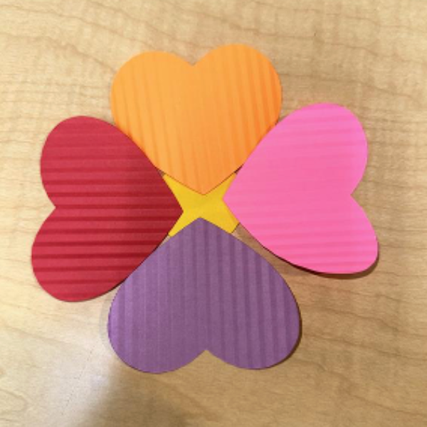 Four rainbow heart shaped petals.