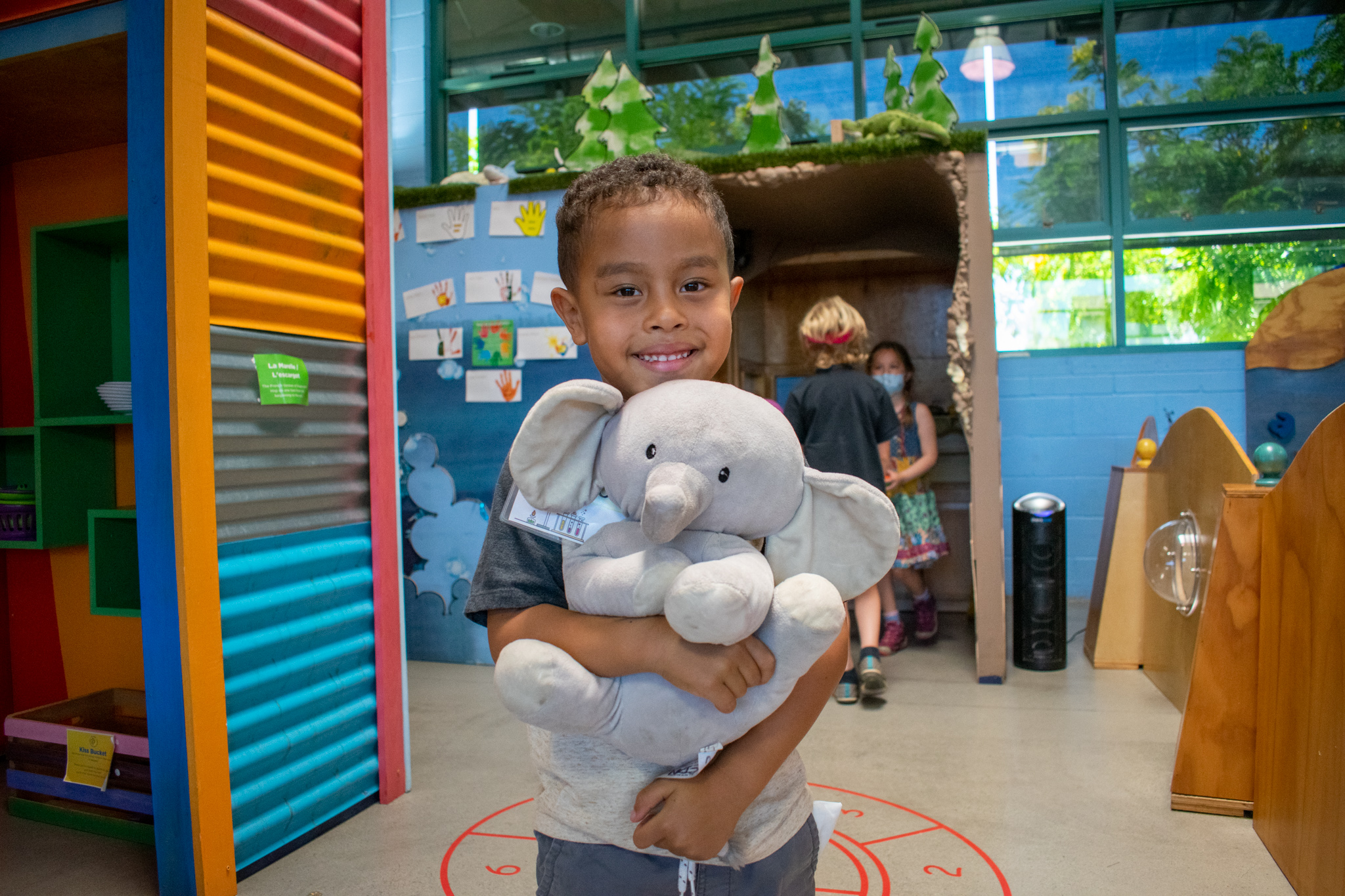 Fall Camps little boy holding a stuffed elephant