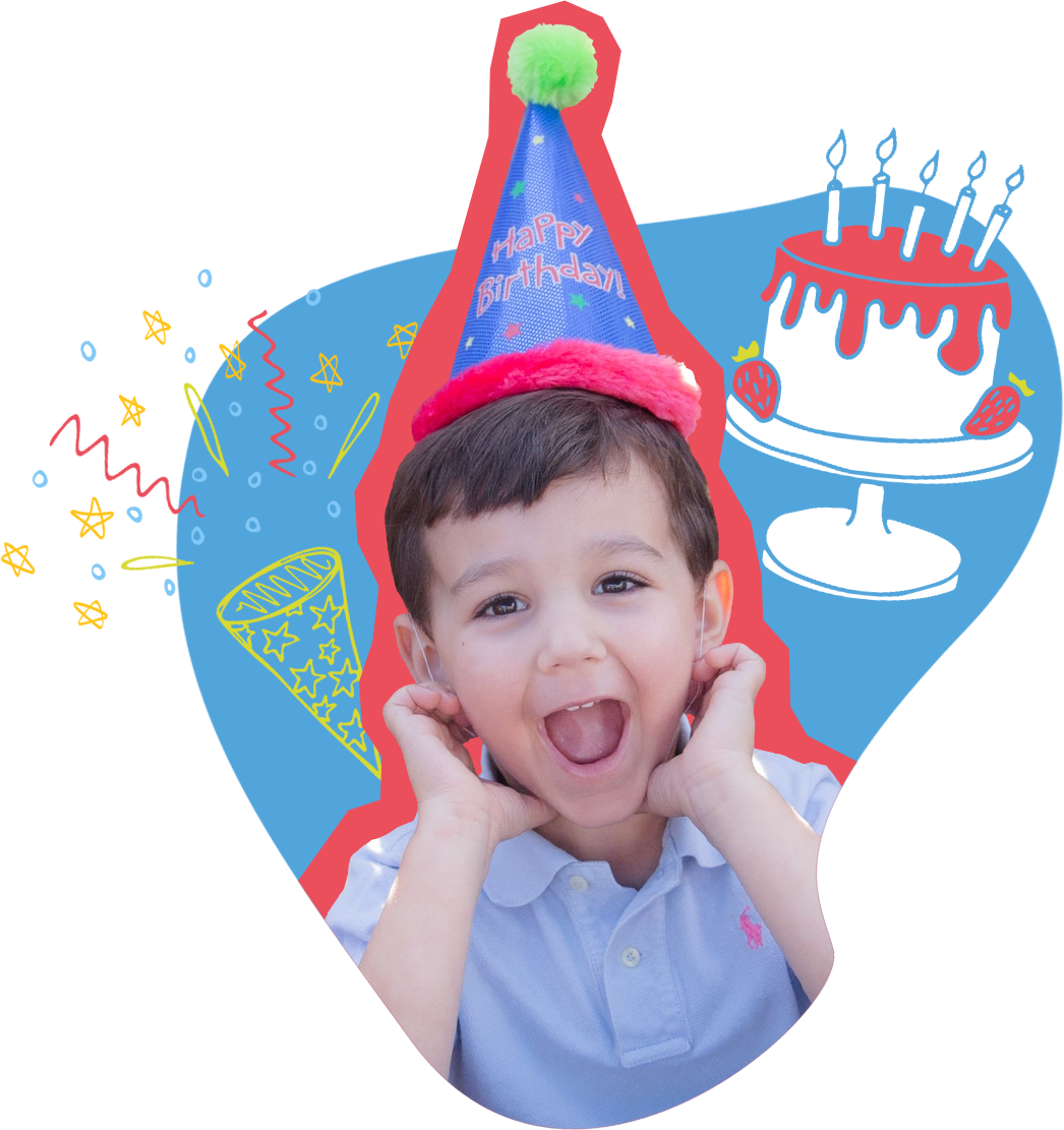 little boy at birthday party with birthday hat on