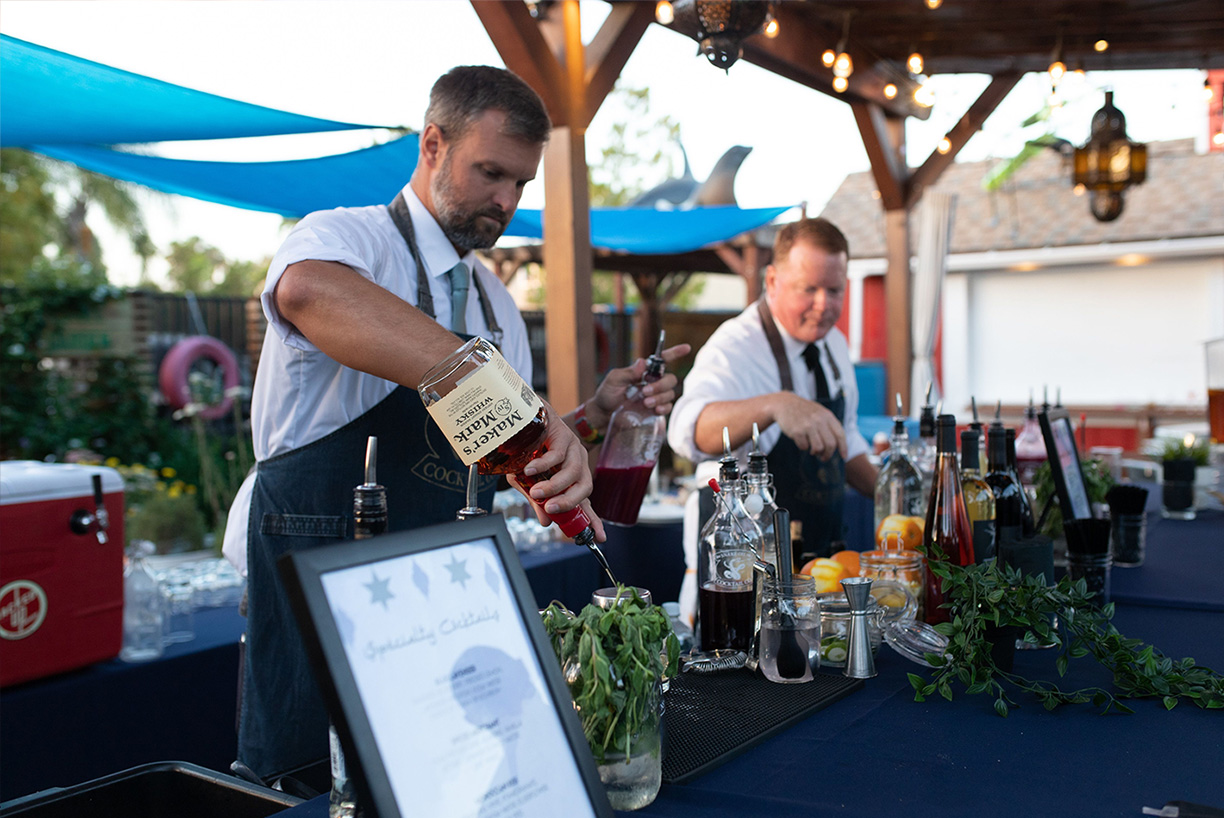 bartenders making drinks at an event