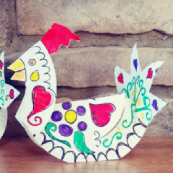 Paper plate rooster craft with hand drawn details.