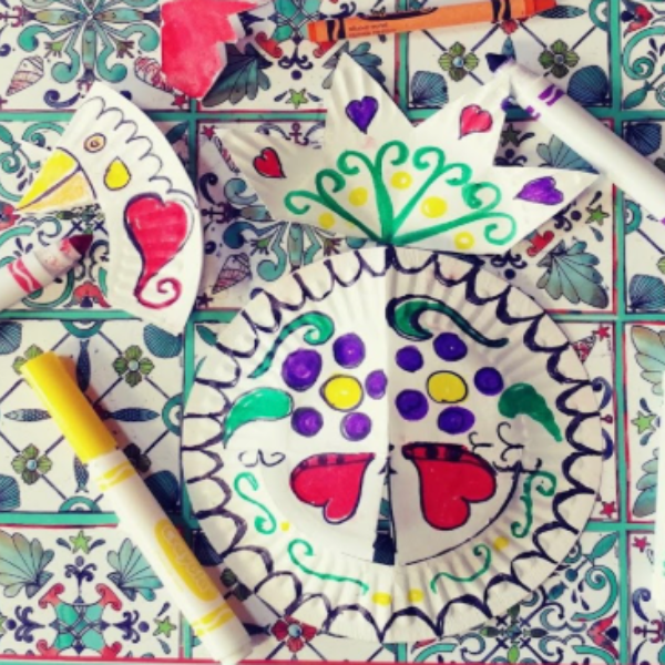 Individual pieces of the paper plate rooster with colorful designs.